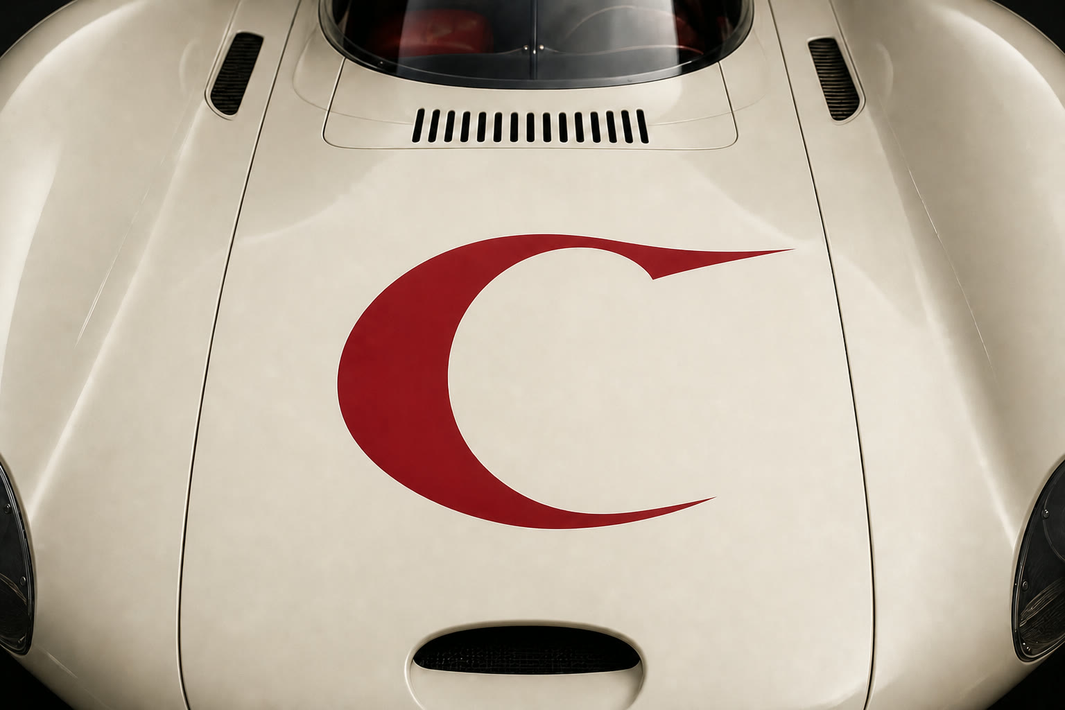 Cream performance car with the oxblood Campagne Velocity C across the hood